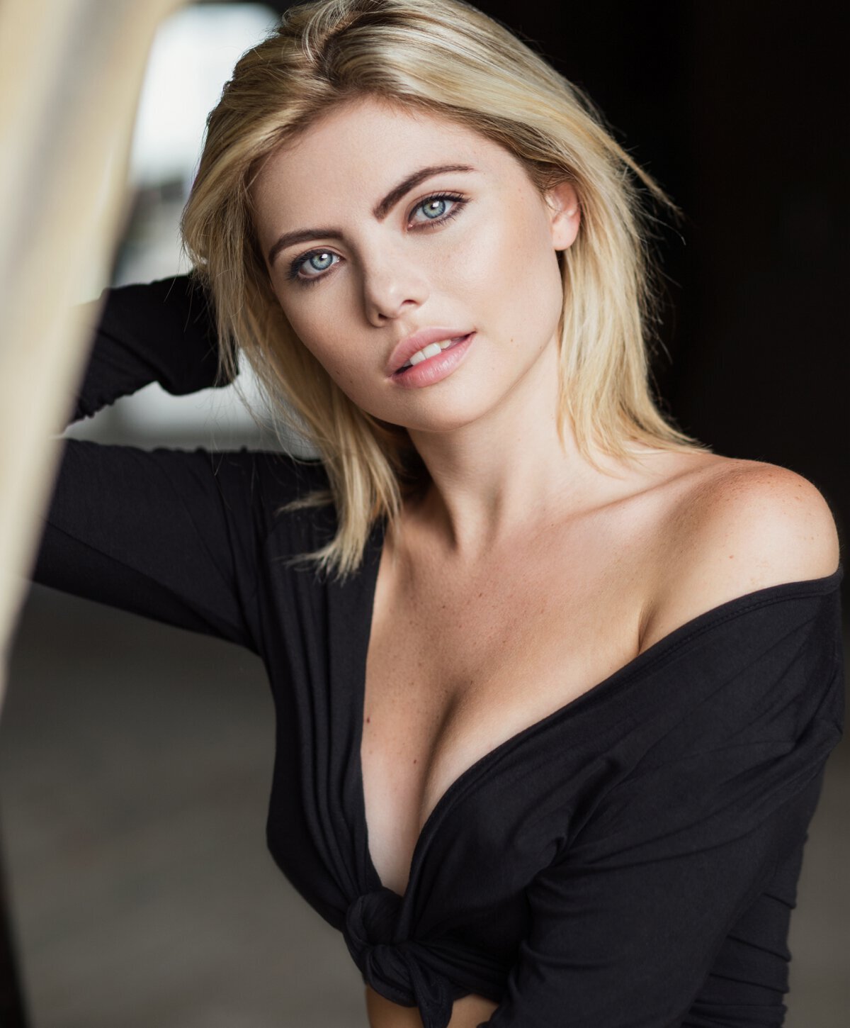 blonde Manchester Breast Augmentation patient model wearing a black shirt